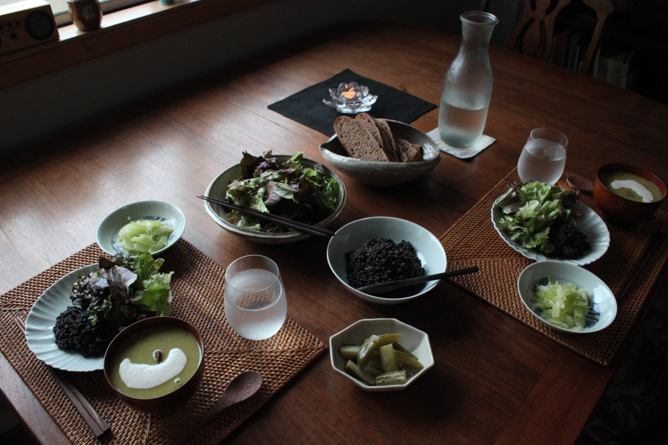 Sunday dinner with sourdough bread, soup, legume, and salads