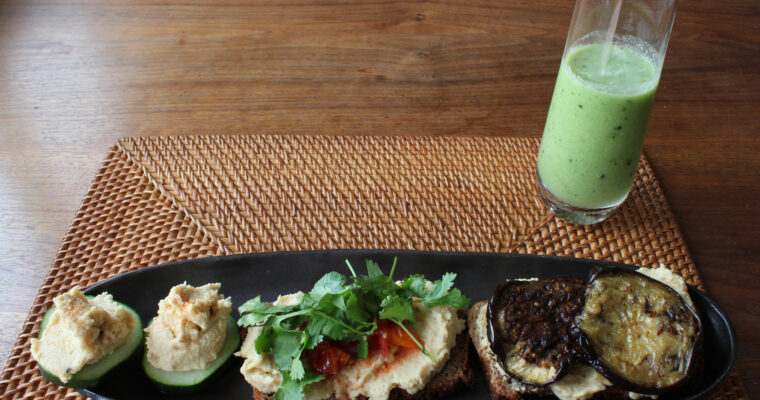 Open sandwich with hummus and cucumber-watermelon smoothie